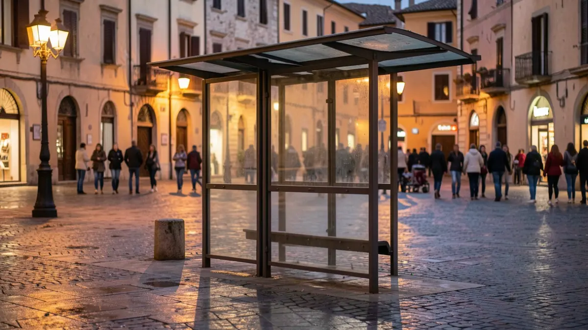 Generic image of a bus stop in a Mediterranean town at dusk.